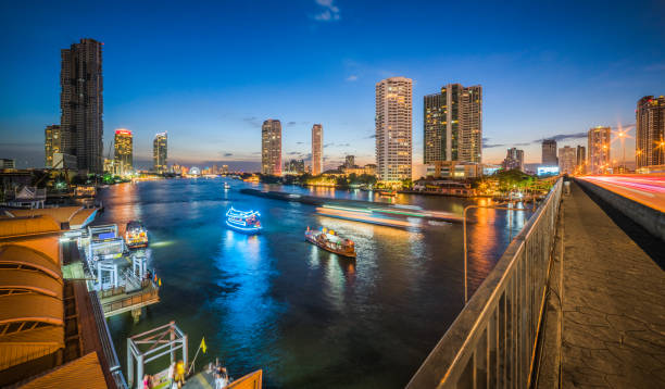 istock Skyscrapers and Traffic in Modern City with River 1174887063