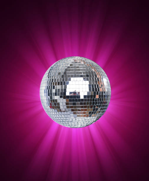 istock Shining Disco Ball on pink background light 1174887164