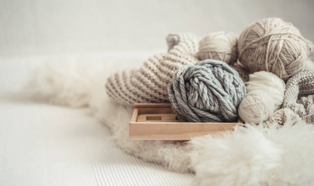 istock cozy background Wallpaper with the yarn for knitting. 1174888018