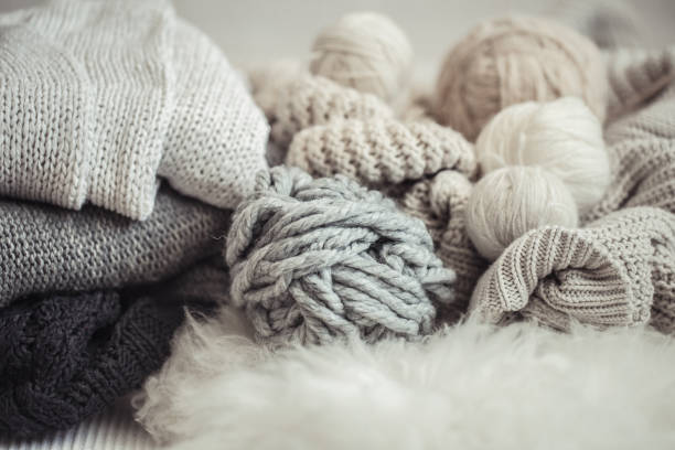 istock cozy background Wallpaper with the yarn for knitting. 1174888035