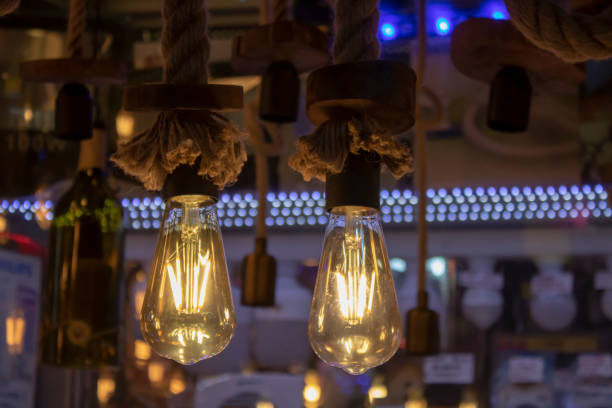 istock Lamps hanging on rope, brown rope and yellow light 1174890091