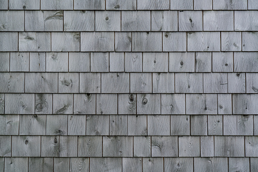 Exterior of a weathered gray cedar shingle wall
