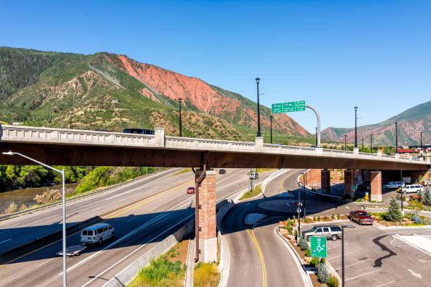 Aerial view of Roaring Fork Colorado river in downtown with water and overpass highway Glenwood Springs, USA - July 10, 2019: Aerial view of Roaring Fork Colorado river in downtown with water and overpass highway in summer garfield county montana stock pictures, royalty-free photos & images