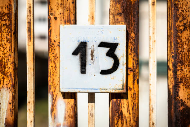 istock Street number sign on the wall 1174892737