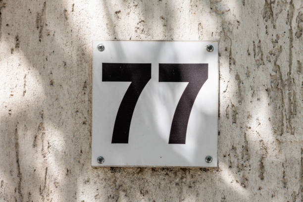 istock Street number sign on the wall 1174892751