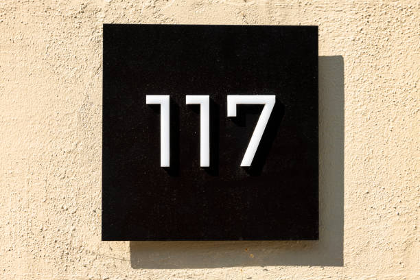 Street number sign on the wall