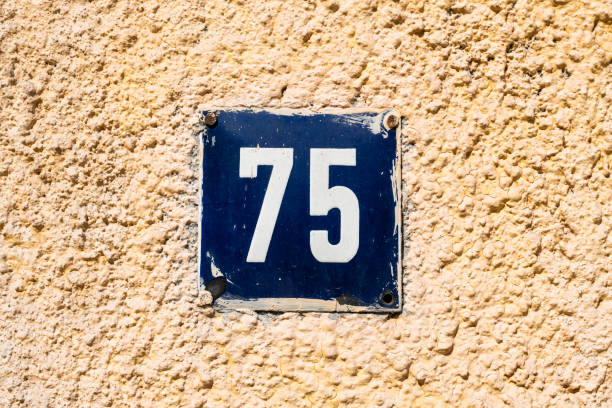 istock Street number sign on the wall 1174892815