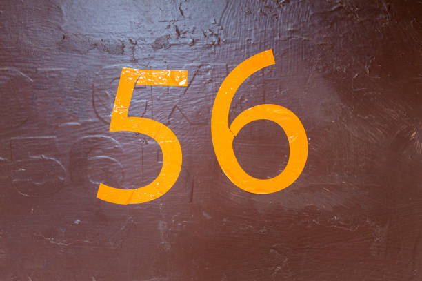 istock Street number sign on the wall 1174892859