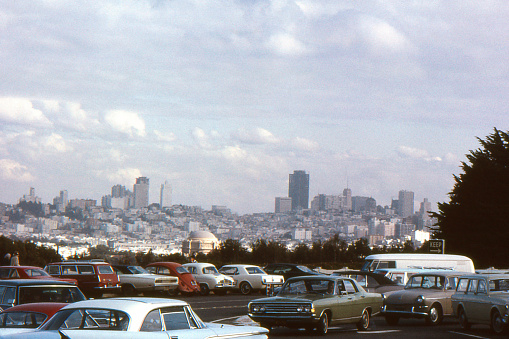 San Francisco, California, USA skyline in 1969. Bank of America Building, 555 California Street (tallest building right of center) was completed the same year. Domed Palace of Fine Arts in center front. Scanned film with significant grain.