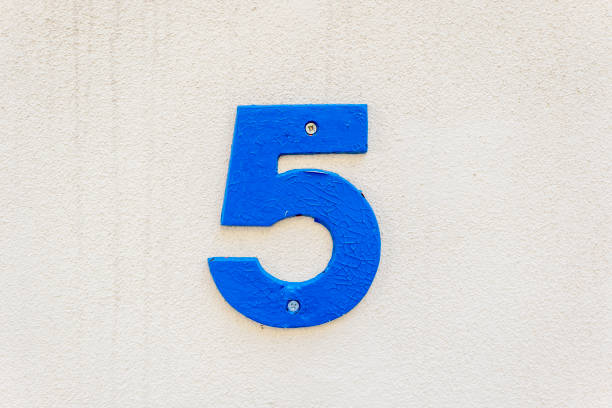 istock Street number sign on the wall 1174893466