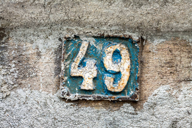 istock Street number sign on the wall 1174893469
