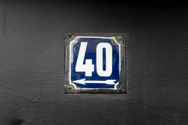istock Street number sign on the wall 1174893481