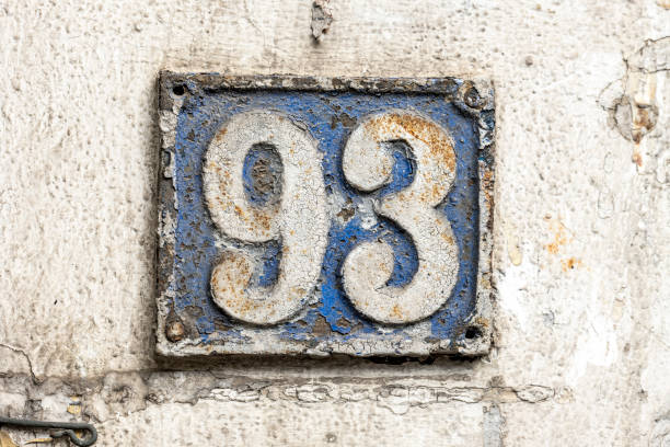 istock Street number sign on the wall 1174893517