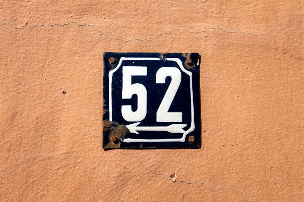 istock Street number sign on the wall 1174893524
