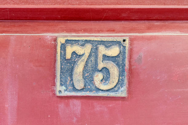 istock Street number sign on the wall 1174893569