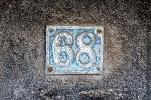 istock Street number sign on the wall 1174893579