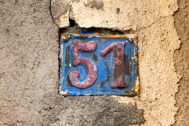 istock Street number sign on the wall 1174893598