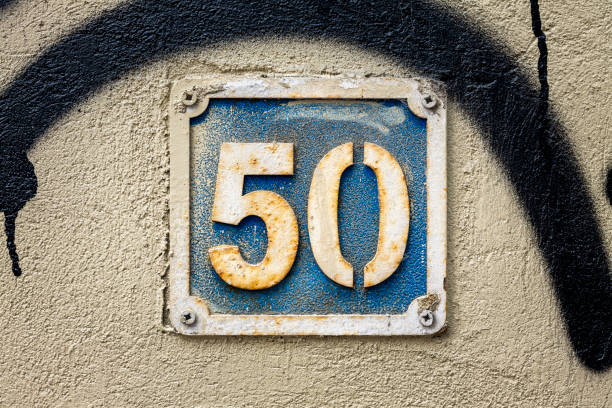 istock Street number sign on the wall 1174893601