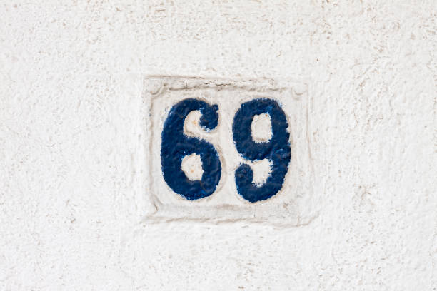istock Street number sign on the wall 1174893617
