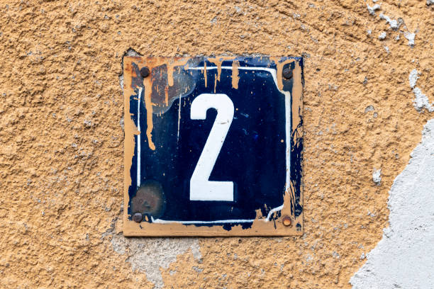 istock Street number sign on the wall 1174893620