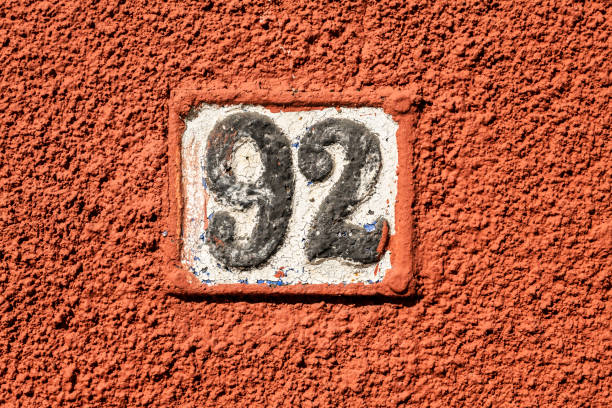 istock Street number sign on the wall 1174893621