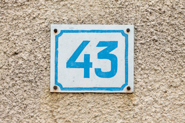 istock Street number sign on the wall 1174893773