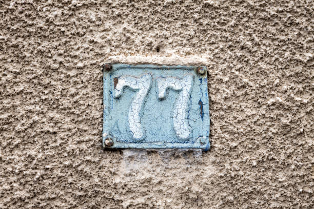 istock Street number sign on the wall 1174893805