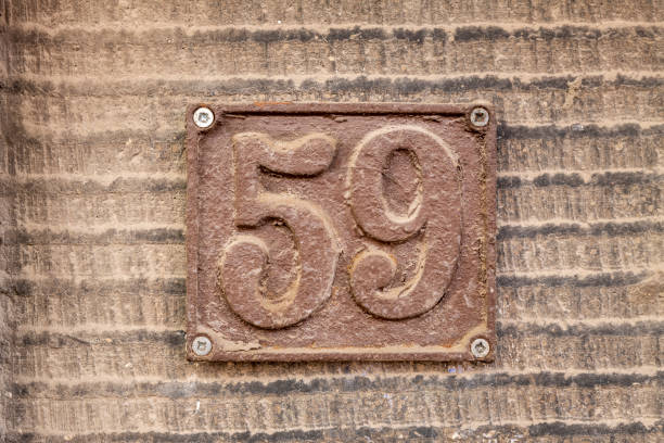 istock Street number sign on the wall 1174893807