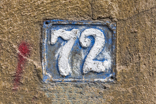 istock Street number sign on the wall 1174893808