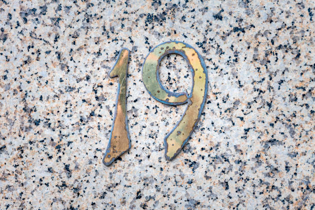 istock Street number sign on the wall 1174893897