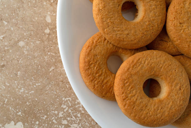 istock Coconut cookies arranged on a white plate top view 1174894481
