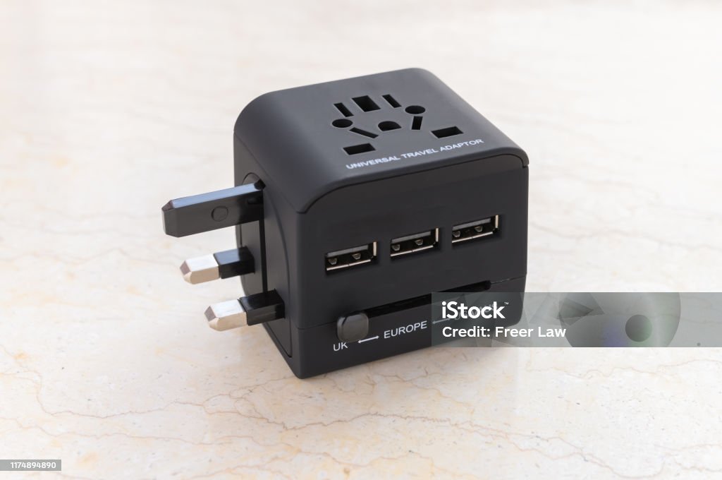 a brand new black universal adapter Plug Adapter Stock Photo