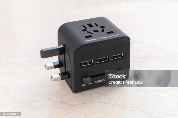 A Brand New Black Universal Adapter Stock Photo - Download Image Now - Plug Adapter, Travel, Electric Plug