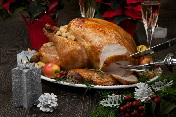 istock Carving Roasted Christmas Turkey with Grab Apples 1174894893
