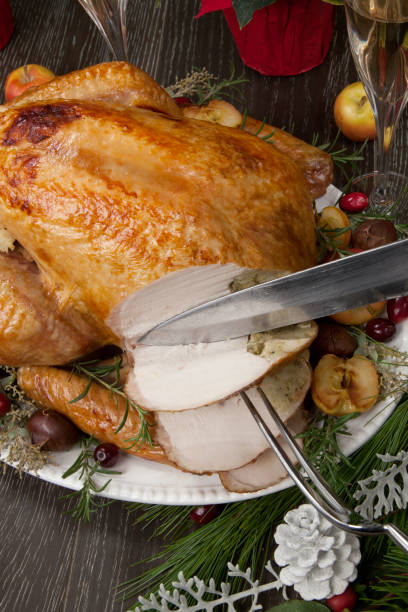 istock Carving Roasted Christmas Turkey with Grab Apples 1174894926