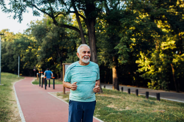 istock Older man running in the park 1174894929