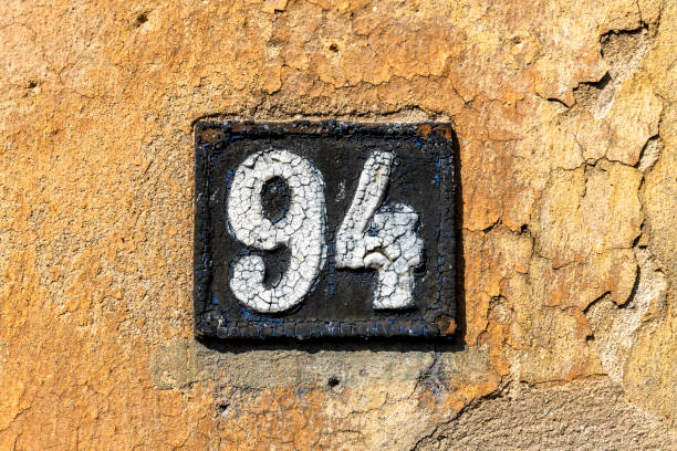 istock Street number sign on the wall 1174895736