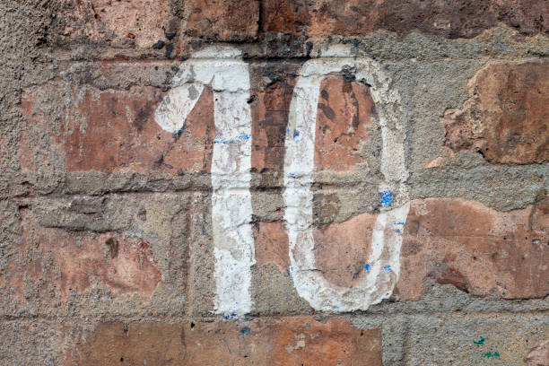 istock Street number sign on the wall 1174895874