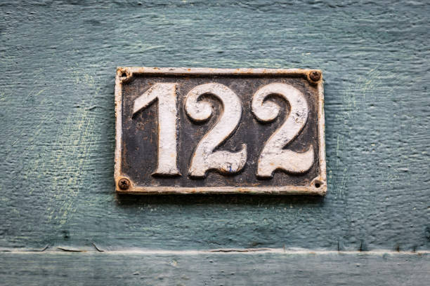 istock Street number sign on the wall 1174895976
