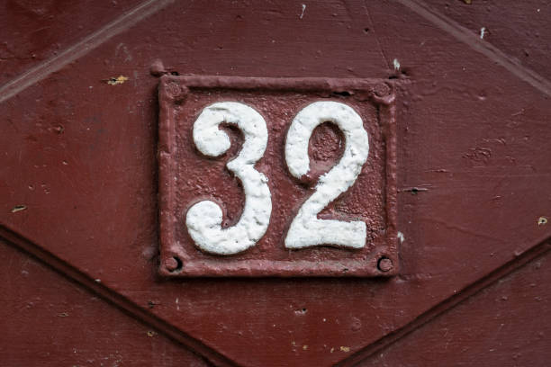 istock Street number sign on the wall 1174895980