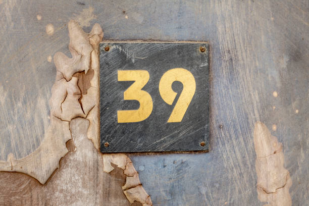 istock Street number sign on the wall 1174895984