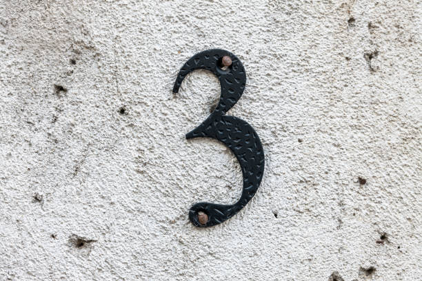 istock Street number sign on the wall 1174896753