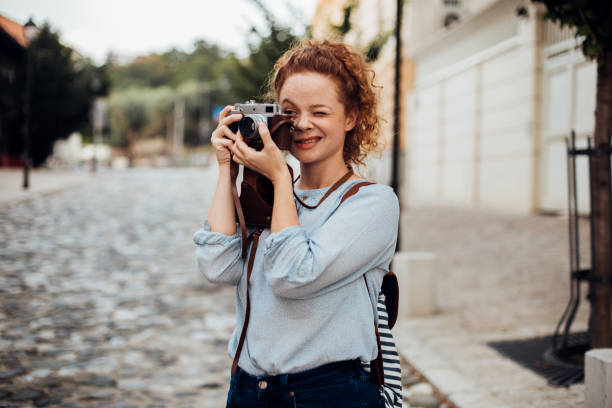 istock Girl taking photos 1174896880