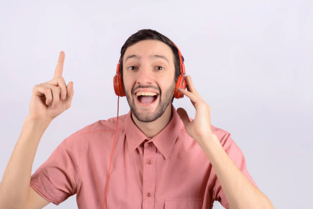 istock Young funny man with headphones 1174897410