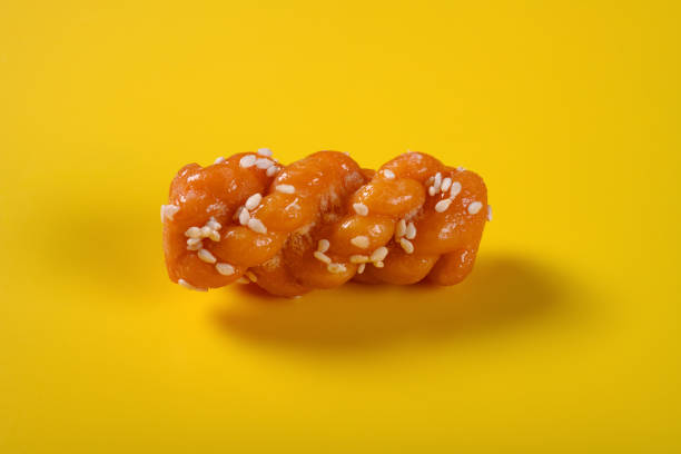 istock traditional Chinese twisted deep fried dough on yellow background 1174900452