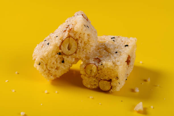 istock side view traditional Chinese crisp rice block with peanuts on yellow background 1174900463