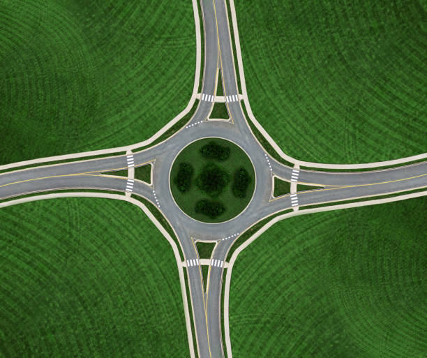 rond-point symmetry - traffic roundabout photos et images de collection