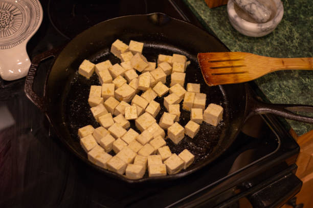 istock Tofu Cooking in Cast Iron Pan 1174901608