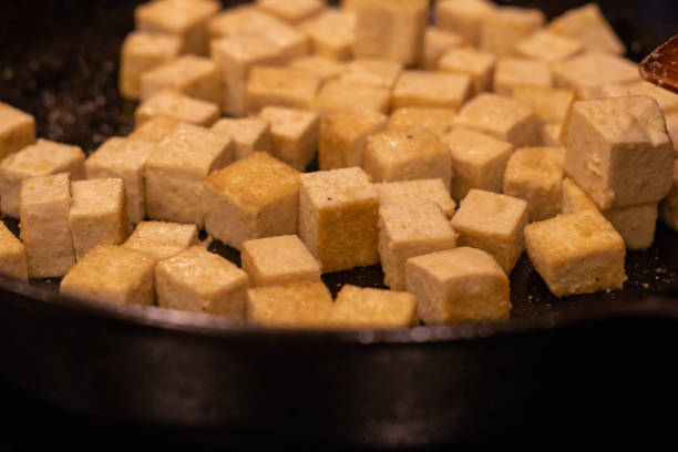 istock Tofu Cooking in Cast Iron Pan 1174901655