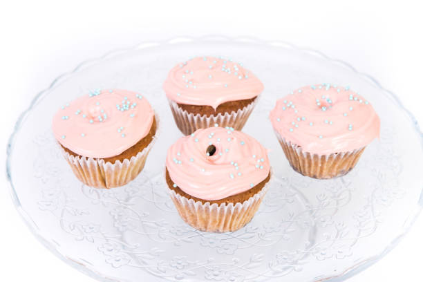 istock Sweet dessert, cupcake with butter cream isolated on white background. 1174902521